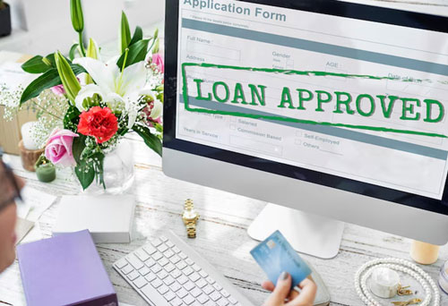 Loan approved on a computer screen